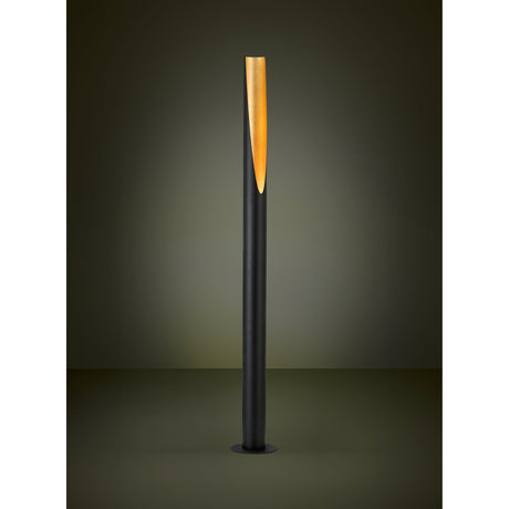 Prebone Floor Lamp in black, a tall slim aluminium and steel tube with an angled cut-out revealing a gold leaf lining, on a round black base, shown against a dark background.
