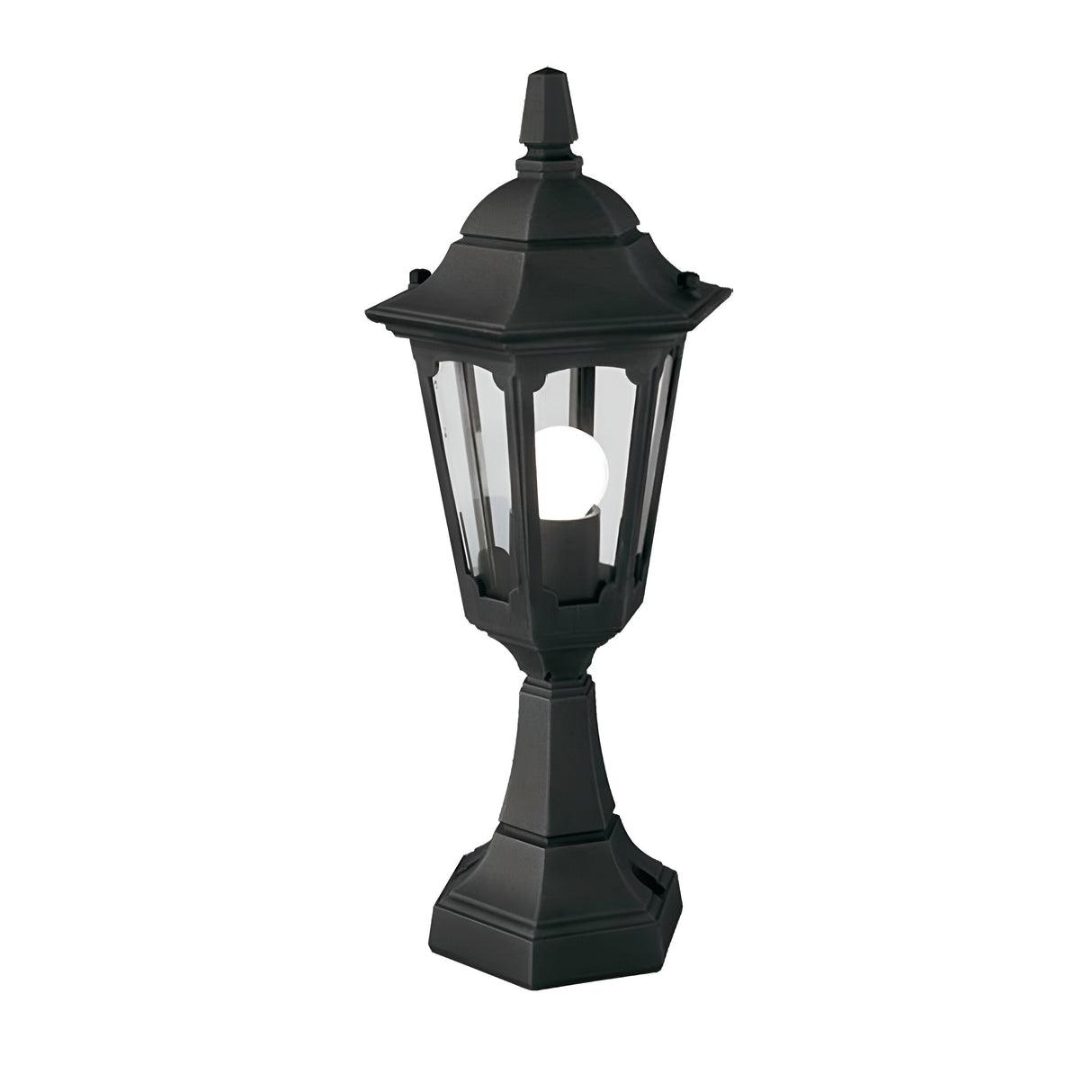 The Parish Mini 1 Light Pedestal Light in black features a vintage-style outdoor lantern design with a glass enclosure and visible bulb inside. Its hexagonal structure and pointed top enhance its charm in outdoor lighting, elegantly showcased against a white background.