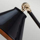 Close-up of the Provence Element 1 Light Mini Table Lamp in Black/Polished Brass, showcasing a French-inspired design. The sleek metal arm and glossy shade elegantly reflect light against a neutral, light background.