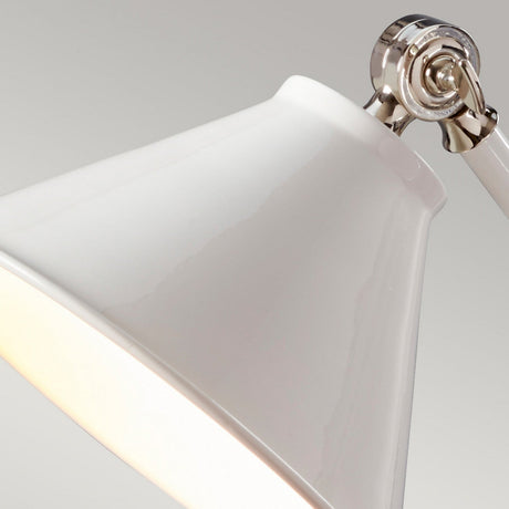 Close-up of the Provence Element 1 Light Mini Table Lamp in white and polished nickel. The lamp's glossy shade, along with its polished nickel joint, is angled to the side and set against a plain gray background.