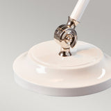 Close-up of the Provence Element 1 Light Mini Table Lamp in white with a polished nickel adjustable joint, set against a smooth grey background.