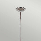 The Provence 1 Light Pendant in polished nickel features a vintage-inspired design with a metallic base and an elegant twisted brown cord. Its timeless charm is accentuated against a plain, light-colored background.