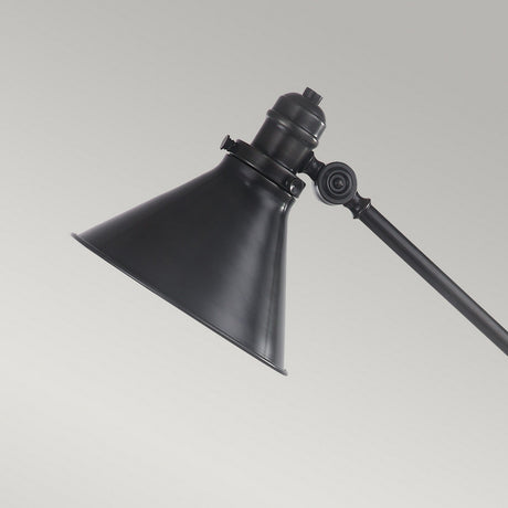 The Provence 1 Light Table Lamp - Old Bronze showcases a sleek, black metal adjustable design with knuckle joints and a conical shade. Set against a plain gray background, its old bronze finish brings an enduring elegance to any room.