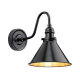 The Provence 1 Light Wall Light in an Old Bronze finish features a black metal construction with a conical shade. Its arched arm elegantly connects the light to a circular wall plate, while the white interior of the shade casts a warm, vintage-inspired glow.