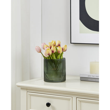 Qichazhen 15cm ribbed glass hurricane lantern in smoky green, holding tulip stems on a cream sideboard beneath framed wall art.