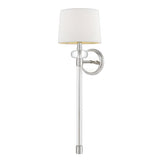 The Barbour 1 Light Wall Light in polished nickel boasts a sleek silver finish, a cylindrical base, and an off-white fabric lampshade. This contemporary decor fixture is mounted on a circular silver plate, providing both modern elegance and ambient illumination.