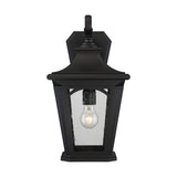 The Bedford Outdoor 1 Light Large Wall Lantern in black is a weather-resistant fixture with a classic design, showcasing a rectangular shape and clear glass panel. The visible bulb inside adds vintage charm, elegantly displayed against a plain white background.