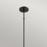 The Bismarck 1 Light Mini Pendant - Black features a geometric flair with its black rod design, hanging elegantly from a ceiling. It includes a round base and chain link, set against a plain white background to emphasize its sleek metal construction and offer subtle ambient lighting.