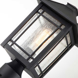 The Cedar Point 1 Light Pedestal - Black exudes vintage character with its lit bulb and simple geometric design. Its glass panels and metal framing create a warm glow, making it perfect for stylishly illuminating outdoor pathways.