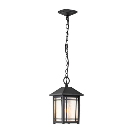 The Cedar Point Outdoor 1 Light Chain Pendant in black features a charming square lantern-style frame that elegantly exemplifies rustic sophistication. Its seedy glass panels lend a classic accent, elevating the overall allure of this distinguished fixture.