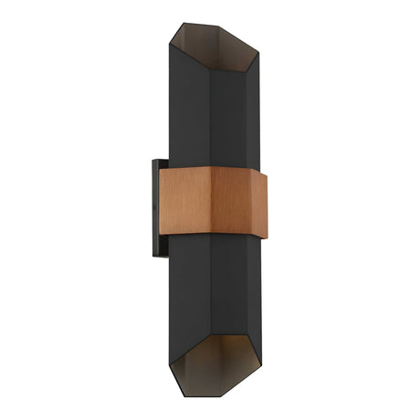 The Chasm Outdoor LED Large Wall Lantern in Matte Black showcases a modern design with integrated LED technology, featuring two elongated hexagonal shades and a central copper accent. Its geometric shape allows light to emit from both ends, making it ideal for contemporary interiors.