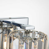 Close-up of the Divine 1 Light Wall Light in polished chrome, showcasing prismatic crystal glass panels for a sleek and elegant design.