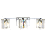 The Divine 3 Light Wall Light - Polished Chrome boasts three cylindrical lamps accented with crystal glass, all mounted on a stylish horizontal polished chrome bar. These lamps display visible bulbs and are complemented by a reflective rectangular backplate, providing an elegant enhancement to any room.
