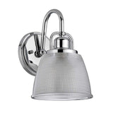 The Dublin 1 Light Wall Light in polished chrome features a curved arm and ribbed glass shade, offering a sleek, modern design ideal for bathroom lighting against a white background.