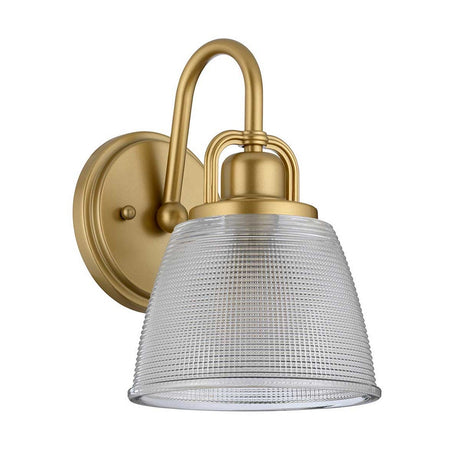 Introducing the Dublin 1 Light Wall Light in Natural Brass, a bathroom lighting piece that features a textured glass shade. Its curved arm and round backplate provide a perfect blend of modern and classic design elements, ideal for wall mounting.