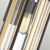 Close-up of the Goldenrod Outdoor 1 Light Medium Wall Lantern - Bronze, showcasing an exposed Edison bulb encased by sleek metal bars that evoke a Mid-Century Lighting style. The contrasting gold and black bars harmonize with clear glass panels, offering a sophisticated industrial aesthetic.