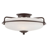 The Griffin 3 Light Flush - Palladian Bronze ceiling fixture showcases a sophisticated circular etched glass shade, encased in an elegant dark Palladian Bronze frame. Its sleek and minimalist design makes it ideal for contemporary interiors.