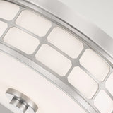 Close-up of the Guardian 2 Light Flush featuring a modern geometric design. It showcases hexagonal metal frames and an opal glass shade in brushed nickel, all in a sleek flush mount design against a light gray background.