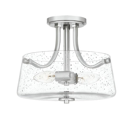 The Hollister 2 Light Semi-Flush - Polished Nickel ceiling fixture showcases a polished nickel finish and a clear seeded glass shade. It includes two exposed bulb sockets joined by gracefully curved metal arms, offering a modern and chic look.