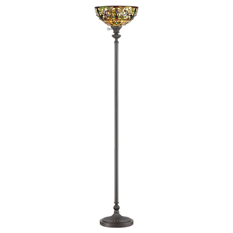 The Kami 1 Light Tiffany Torchiere in Vintage Bronze is a tall and elegant floor lamp that showcases a handcrafted stained glass shade with a floral pattern in shades of green, amber, and red. It features a round base and a slender, decorative pole.