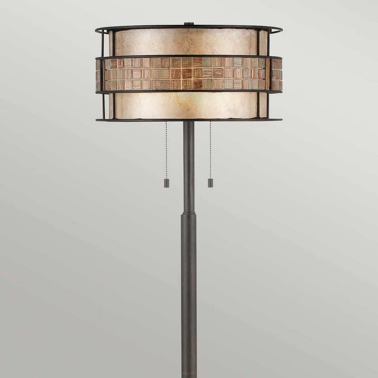 The Laguna 2 Light Floor Lamp - Renaissance Copper features a cylindrical two-tone shade accentuated by a Renaissance copper mosaic center. Its sleek black metal stand is elegantly enhanced with two pull chains for operation, set against a simple light gray backdrop.