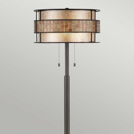 The Laguna 2 Light Floor Lamp - Renaissance Copper features a cylindrical two-tone shade accentuated by a Renaissance copper mosaic center. Its sleek black metal stand is elegantly enhanced with two pull chains for operation, set against a simple light gray backdrop.