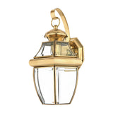 The Newbury Outdoor 1 Light Medium Wall Lantern in lacquered polished brass showcases a classic design with beveled glass panels and an elegant curved arm. Its timeless and sophisticated appearance is heightened by a gleaming finish that effortlessly enhances any exterior setting.
