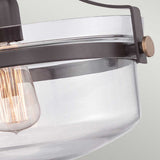 Close-up of the Penn Station 1 Light Semi-Flush in Western Bronze featuring a clear glass shade and visible filament bulb, enhancing its vintage industrial style with a rustic touch.