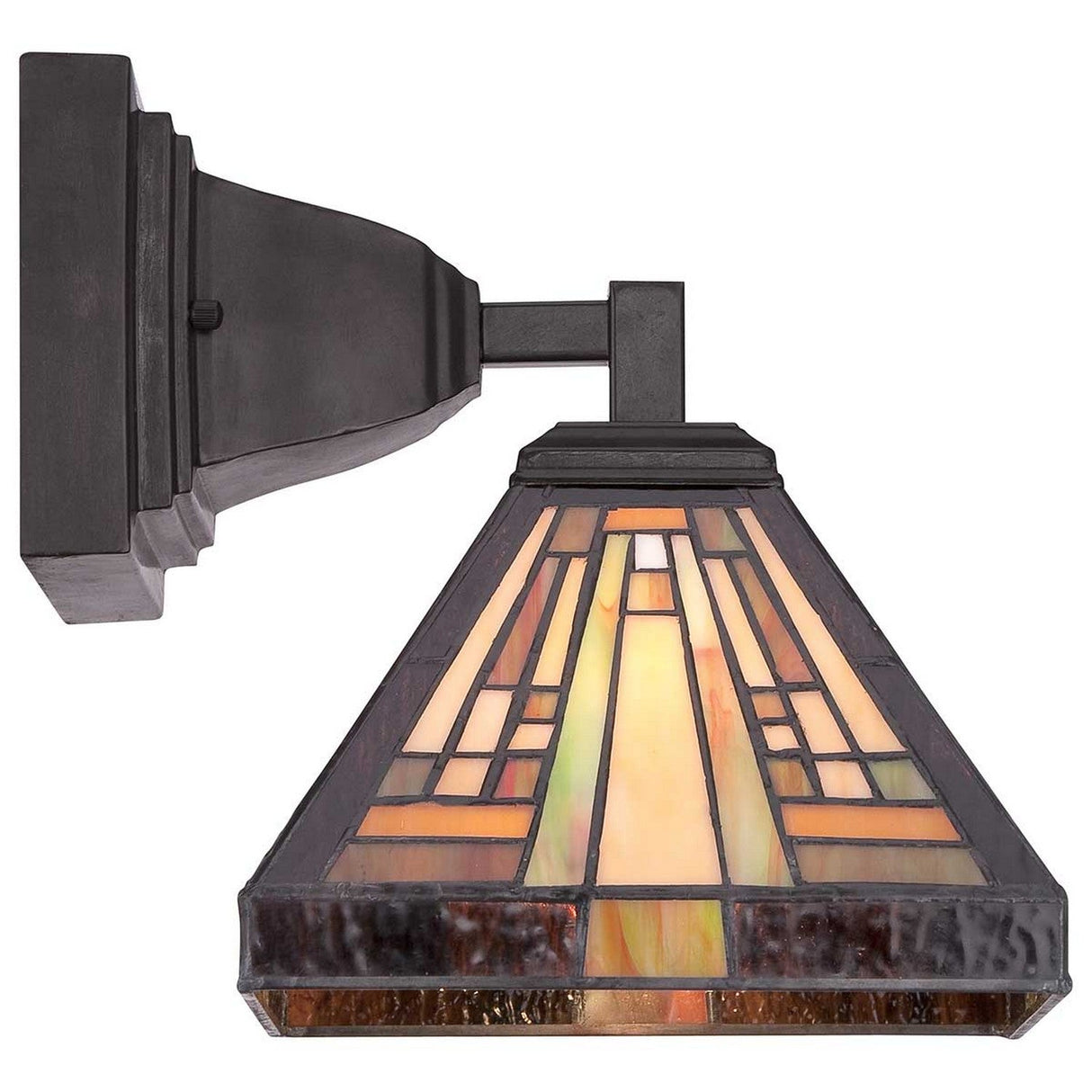 The Stephen 1 Light Tiffany Wall Light in Vintage Bronze showcases a stained glass shade with geometric patterns in amber and brown hues, complemented by a dark bronze fixture. This lamp beautifully reflects the timeless charm of the Arts & Crafts Movement.