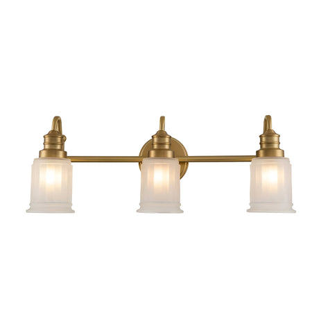 The Swell 3 Light Wall Light in brushed brass features a classic and elegant design, perfect for any sophisticated space. It includes three LED G9 bulbs with frosted glass shades, mounted on a horizontal bar that's connected to a circular wall plate.