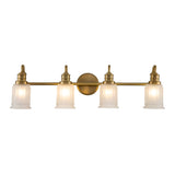 The Swell 4 Light Wall Light in brushed brass brings metropolitan sophistication to any bathroom vanity with its four cylindrical frosted glass shades, each topped with a decorative design. These evenly spaced shades are aligned along a horizontal bar and are supported flawlessly by a central circular mount.