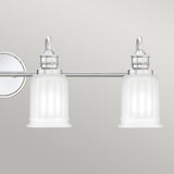 The Swell 4 Light Wall Light - Polished Chrome features two frosted glass shades and a sleek polished chrome frame, making it perfect for enhancing bathroom lighting, displayed against a plain gray background.