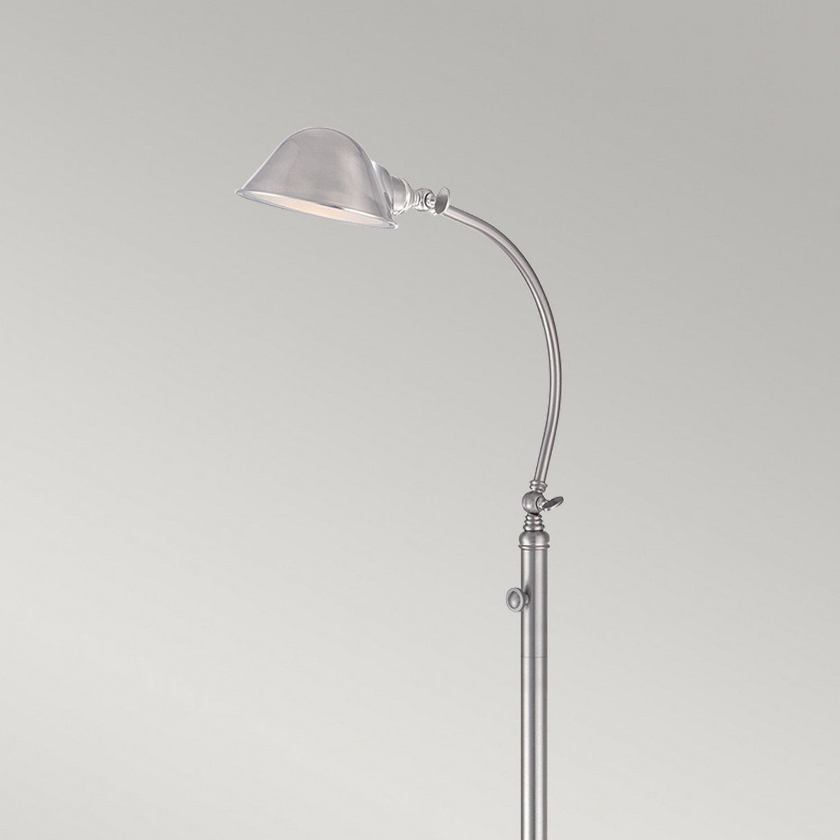 Introducing the Thompson LED Floor Lamp in Brushed Nickel: a sleek, modern design with a curved, adjustable neck and a small dome-shaped lampshade, ideal for task lighting against a plain light gray background.