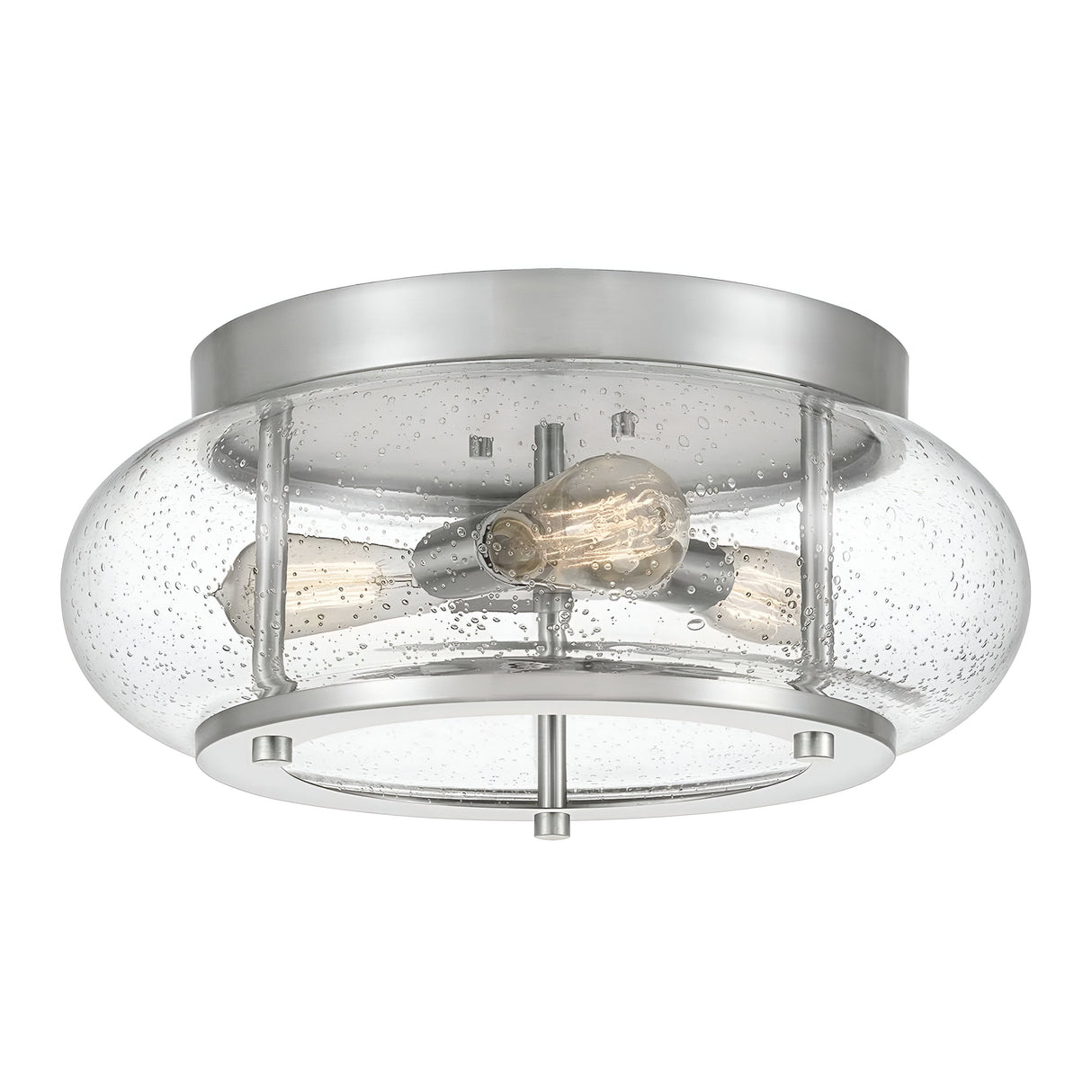 The Trilogy 3 Light Flush - Brushed Nickel is a modern ceiling light fixture that features a brushed nickel base and a clear, seeded glass cover housing two exposed Edison-style LED bulbs, blending industrial and contemporary designs.