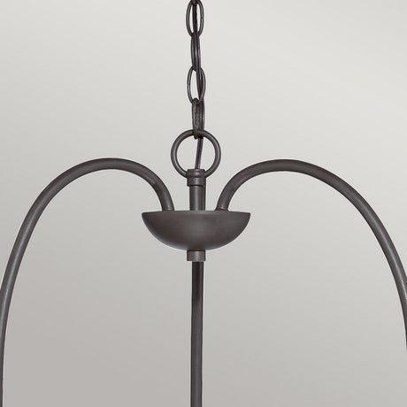 A contemporary pendant light fixture marked by its minimalist design, the Trilogy 3 Light Chandelier in Old Bronze highlights a curved metal frame and an elongated chain for suspension against a simple gray backdrop, enhanced by seeded glass elements.