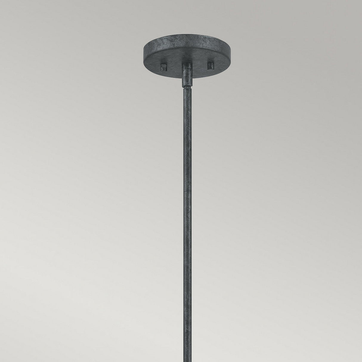 The Vanguard 3 Light Chandelier in Old Black boasts a geometric design with a metal ceiling fixture, round flat base, and straight rod hanging down against a plain background.