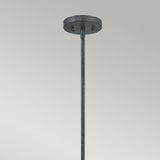 The Vanguard 3 Light Chandelier in Old Black boasts a geometric design with a metal ceiling fixture, round flat base, and straight rod hanging down against a plain background.