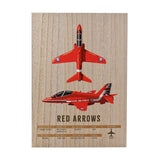 Rectangular wood-effect wall plaque showing two red RAF Red Arrows jets, one from above and one in profile with Union flag tail, above printed aircraft specifications.