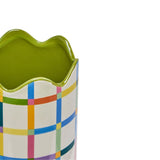 Close-up of a ceramic vase with a wavy green-glazed rim, featuring a multicoloured check pattern in blue, pink, orange, green, purple and yellow on a yellow ground.