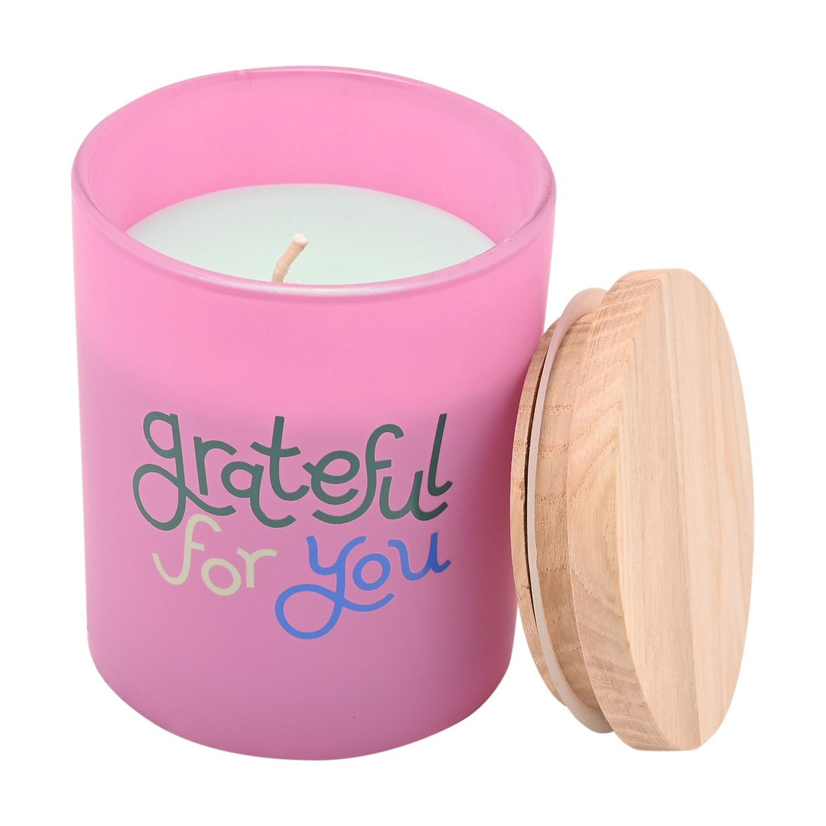 Grateful for You Scented Candle in a frosted pink glass jar with pale wax, single wick, and natural wood lid resting beside it on a white background.