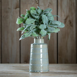 Hill Interiors Lambs Ear Spray with soft silvery-green downy leaves displayed in a ribbed pale ceramic vase against a wooden plank background.