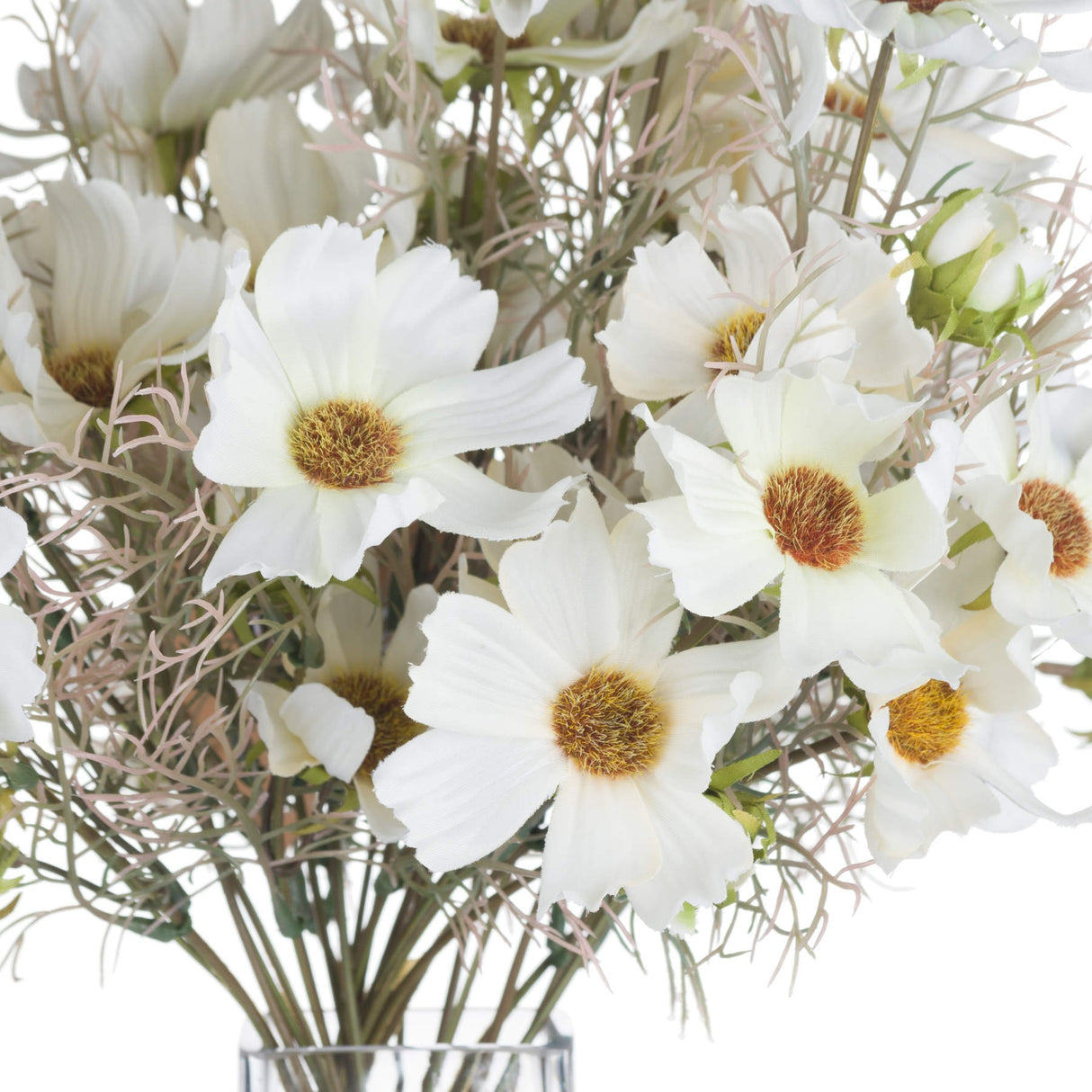 Close-up of Hill Interiors Cream Cosmos Spray showing cream petals with golden-brown centres and wispy foliage in a glass vase.