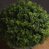 Overhead view of the Hill Interiors Small Hebe Globe Pot, showing the dense green dome of small oval faux leaves with subtle tonal variation.