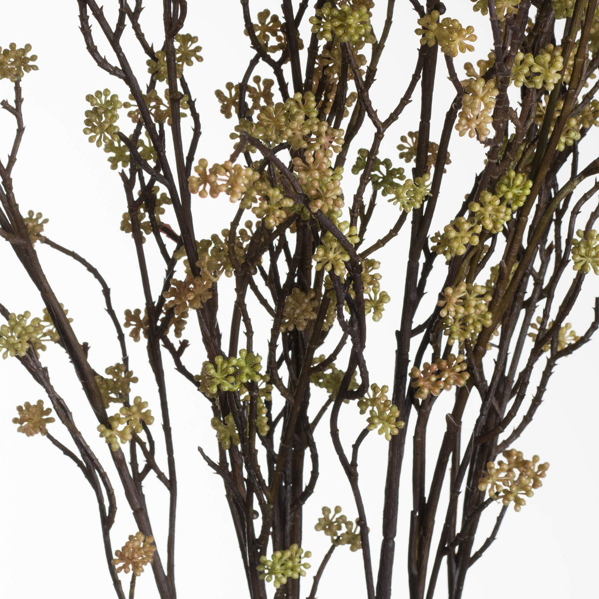 Hill Interiors Branch in Bloom Filler faux stem with slender dark branches and clusters of tiny green blooms, shown against a plain white background.