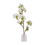 Hill Interiors Tall White Blossom faux stem with clusters of white petals and green leaves along slender branches, displayed in a clear vase.
