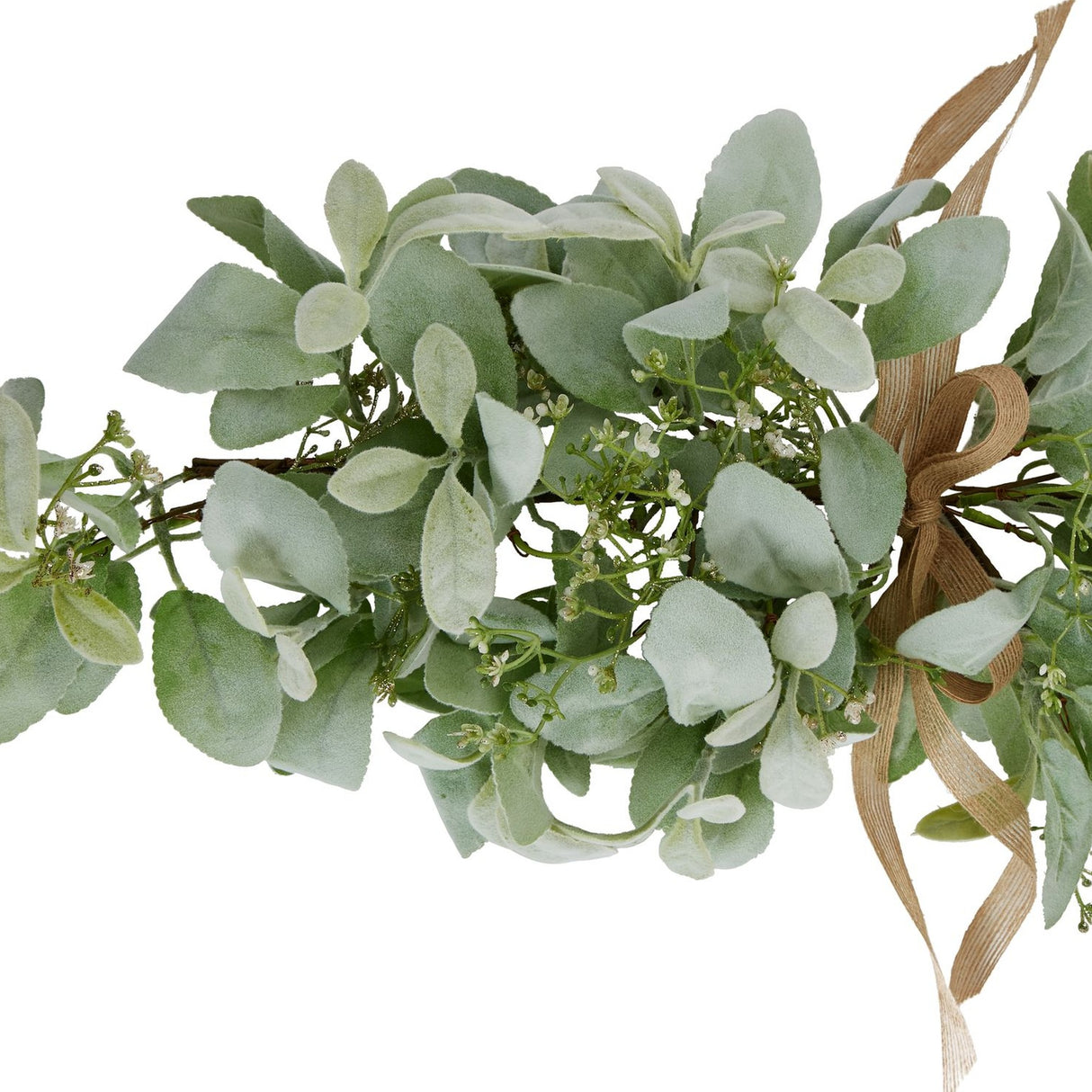 Close-up of Hill Interiors winter spray arrangement with velvety lambs ear leaves, wax flower sprigs and a hessian ribbon bow on a white background.