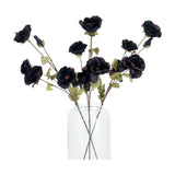 Hill Interiors Tall Black Poppy Stem faux flowers with crinkled matte black blooms and green leaves arranged in a clear glass vase on a white background.