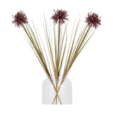Three Hill Interiors Burgundy Aster Spider Chrysanthemum Stems with shaggy deep red blooms and long green grass-like leaves arranged in a clear glass vase.