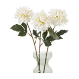 Three Hill Interiors Tall White Dahlia faux stems with layered cream petals and green leaves arranged in a clear glass vase on a white background.