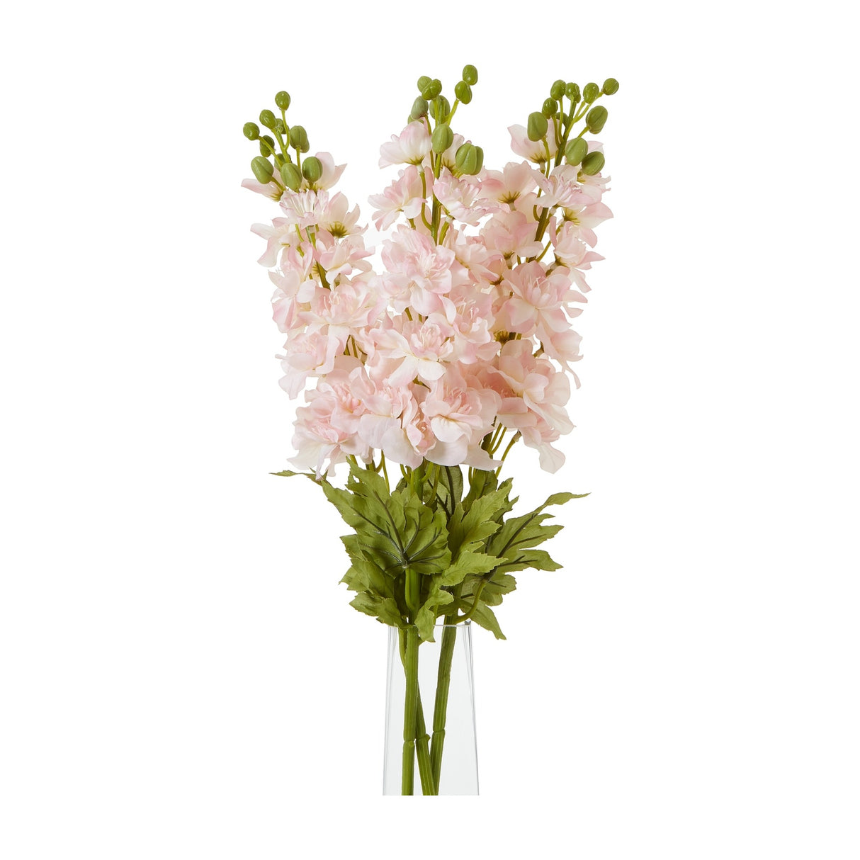Hill Interiors Pink Elatum Delphinium faux stems with soft pink ruffled blooms, green buds and slim foliage in a clear glass vase on a white background.
